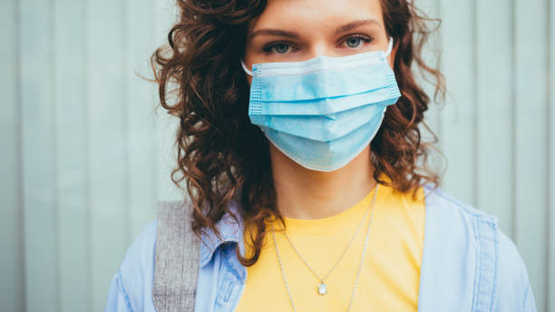 istock A woman wearing a blue mask 2196450378
