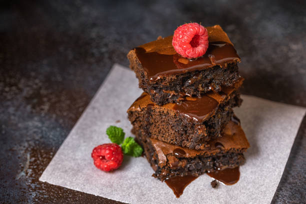 Closeup of a homemade chocolate cake with a shiny, rich glaze, showcasing smooth texture, appetizing details and a warm, inviting homemade dessert atmosphere.