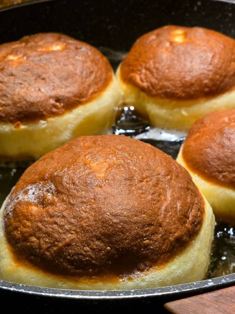 istock Photo of doughnuts fried in oil. 2196451711