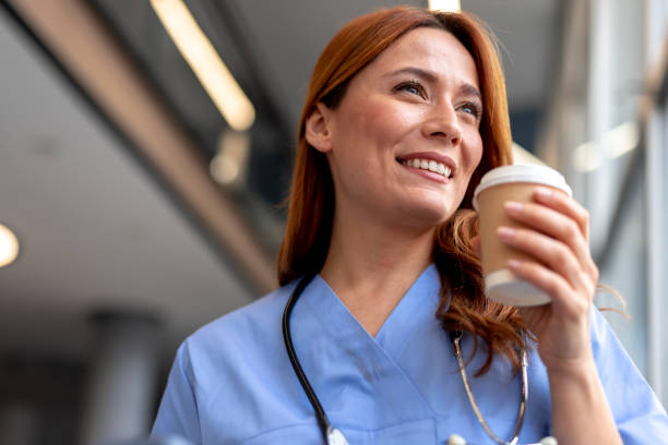 istock Happy doctor drinking coffee during break at hospital 2196452908