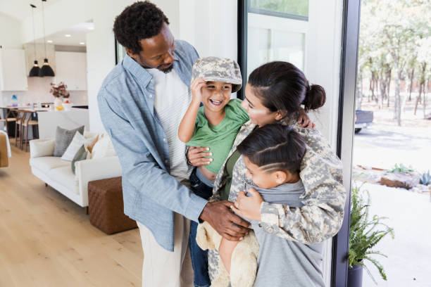 istock Happy Family Reunion: Military Mom Home with Kids 2196455462