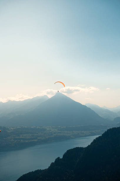 Soaring high above the European Alps in Interlaken, Switzerland while paragliding