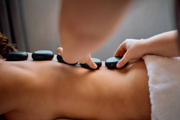 istock Close up of lastone therapy at wellness spa. 2196459556