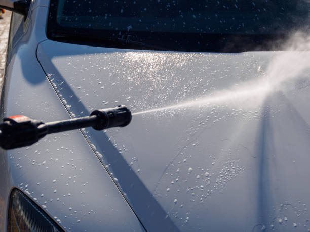 istock Manual car high-pressure wash using equipment for effective dirt removal and coating protection. 2196459990