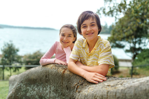 Young boy at the lake with a life jacket on