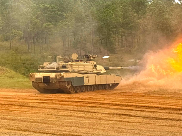 M1A2 Abrams Main Battle Tank (built by General Dynamics Land Systems) Firing at Red Cloud Firing Range at Ft. Moore, GA with muzzle fireball - Fall 2024