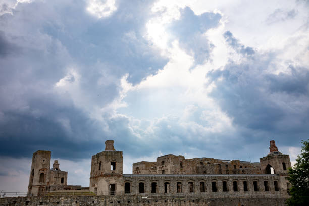 A captivating and striking view of weathered ancient ruins set against a moody sky, evoking both mystery and history