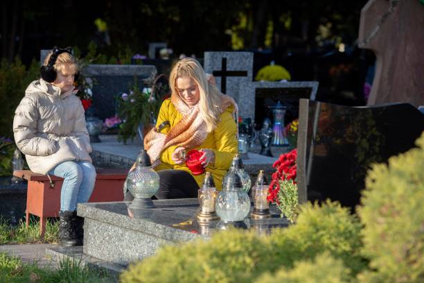 istock Two Women Engaged in Profound and Meaningful Reflection Together at a Calm Cemetery Setting 2196469582