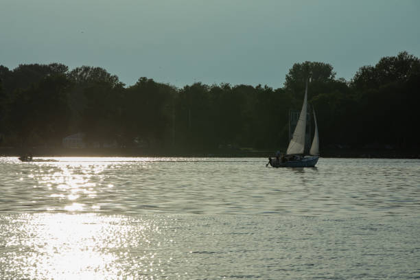 istock Sailing on a Beautifully Tranquil Lake at Dusk, Enveloped by Natures Extraordinary Splendor 2196470557