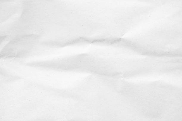istock White recycled craft paper texture as background. Grey paper texture, Old vintage page or grunge vignette of old newspaper. Pattern rough art creased grunge letter. Hardboard with copy space for text. 2196471122