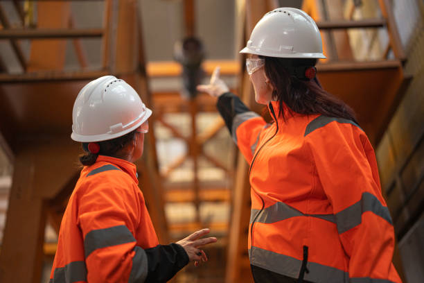 istock Two Engineers Discussing In Modern Industrial Factory 2196471251