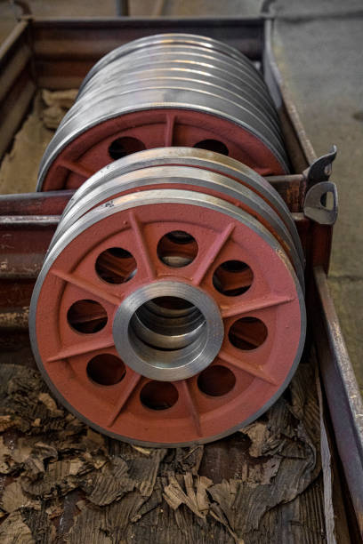 Background image of metal machine parts production.  Shiny production elements in modern factory warehouse. Modernization in the industrial sector concept.