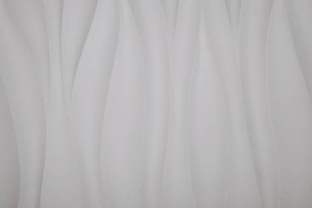 Light shines through the blinds and the curtain