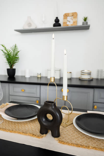 Elegant dining table setup with modern decor and candle holders