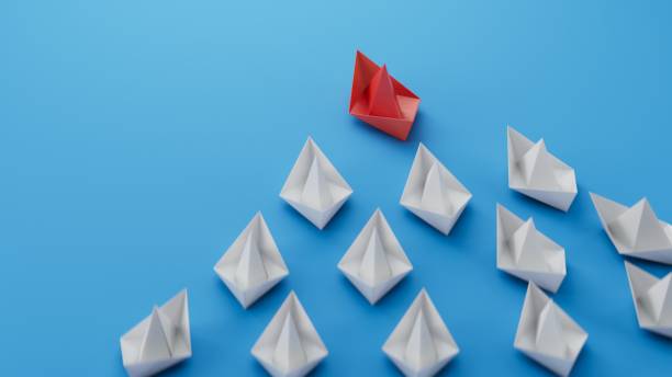 istock winner red paper boat. new ideas. paper art style. creative idea.3D rendering on blue background. 2196472120