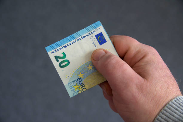 istock A hand holding a twenty euro bill 2196472805