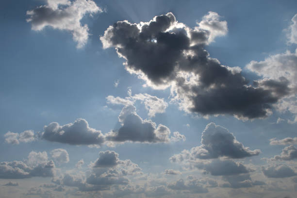Sunbeam over the cloud showing dramatic view of cloudscape. Blue clear sky is natural beauty.