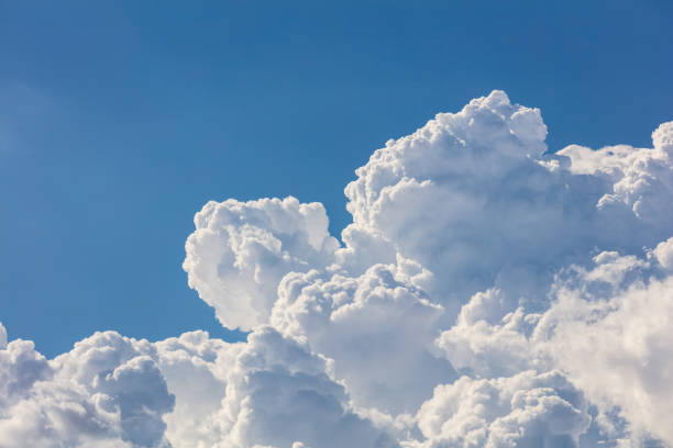 Closeup, cumulus clouds. Blue sky in background. stock photo