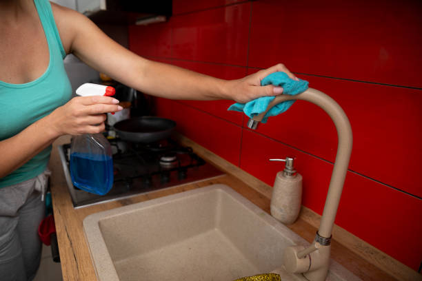 istock Use a spray cleaner to effectively clean your kitchen faucet and keep it looking fresh and shiny 2196477136