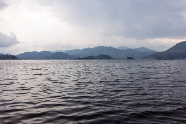 istock Serene Lake Mutanda in Uganda with Mountains Under Overcast Sky 2196477853