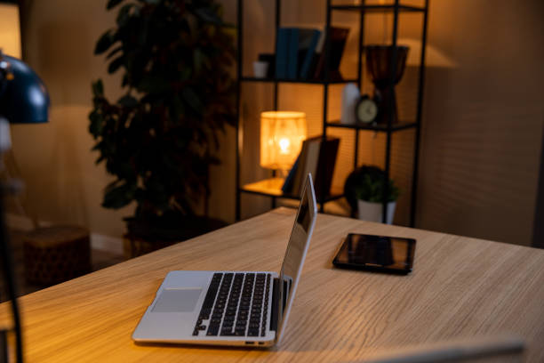 istock Create a Cozy Home Office Setup Featuring a Laptop and Tablet for Productive Work Days 2196479757