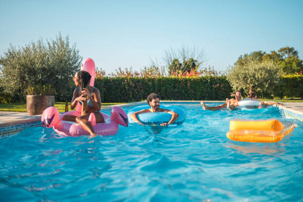 istock Diverse Friends Chilling on Pool Floats 2196483150