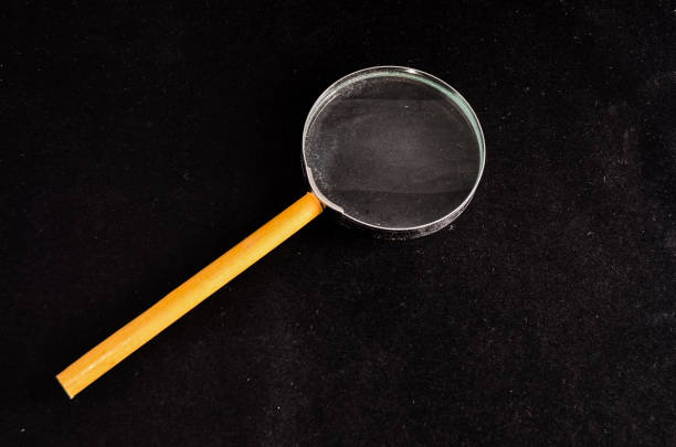 Vintage Magnify Glass Loupe on a Black Background