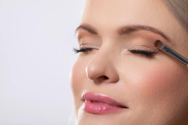 istock The detailed and artistic beauty makeup application process with a blissfully relaxed model 2196486360