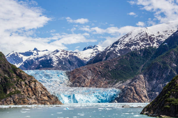 istock Beautiful Glacier Surrounded by Snow-Covered Mountains and Serene Waters 2196487157