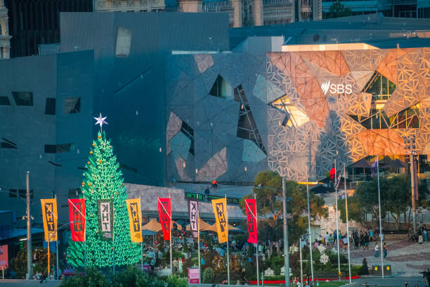 Melbourne's Federation Square decorations in the week prior to Christmas 2023. It's late afternoon and a large green tree dominates the scene.