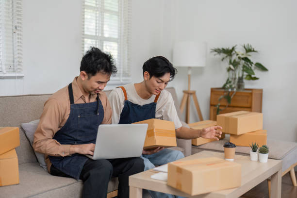 istock Cheerful social media marketers discussing product details while working in their stylish home office 2196488241