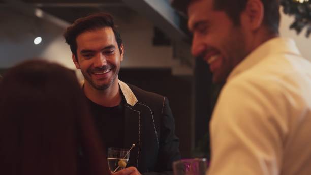 istock Focusing smart man talking with friends while enjoy drinking Martini. Vinosity. 2196491293