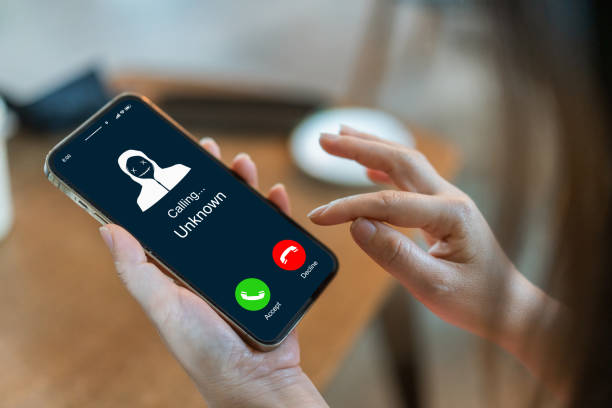 istock Phone scam alert with hacker and scammer calling unknown number, cybercrime, data theft, phishing attempt, fraud alert, digital security threat, cyber attack warning technology and crime concept 2196492320