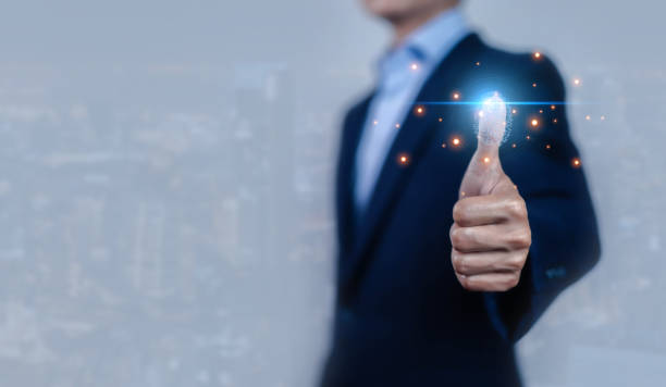 istock Biometric fingerprint scanning is an identification technology that can be used to protect the security of networks as a unique identity of the person. Authentication is done using the thumb. 2196492390