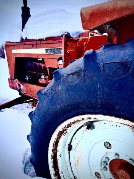istock Antique tractor in the snow 2196492441