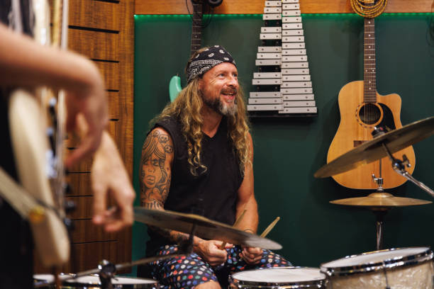 istock Drummer laughing and enjoying himself playing with his bandmates 2196495351