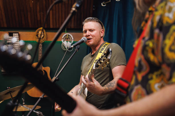 istock Rock singer and guitarist performing in the studio 2196495795