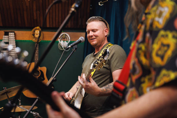 istock Rock singer and guitarist performing in the studio 2196495813