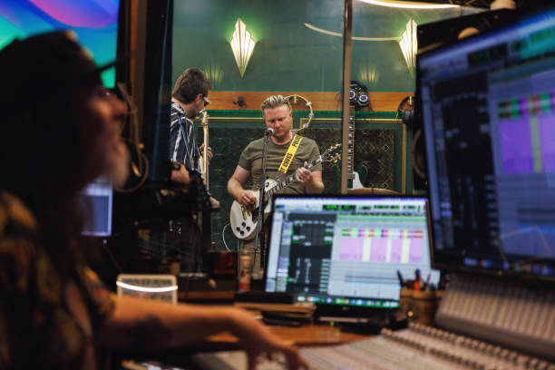 istock Sound engineer / music producer working in recording studio 2196497026