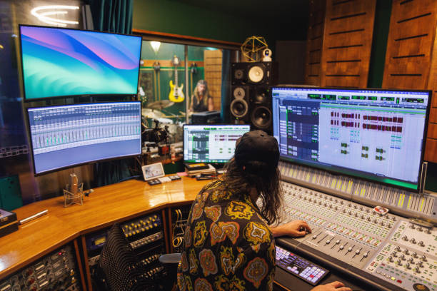 istock Sound engineer / music producer working in recording studio 2196497518