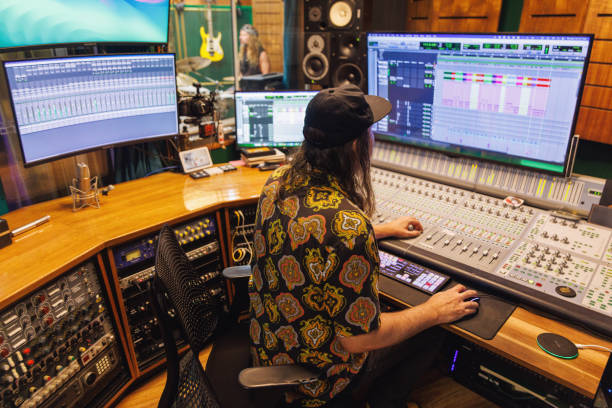istock Sound engineer / music producer working in recording studio 2196497550