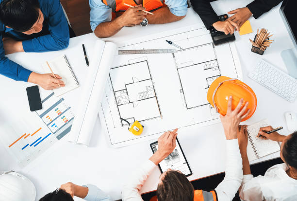 istock Diverse group of civil engineer and client working on architect. Prudent 2196499528