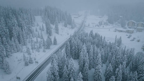istock Aerial view of icy highway during snowstorm 2196500942