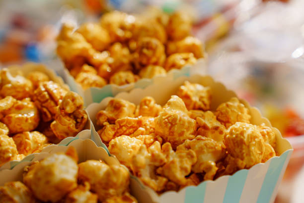 Caramel popcorn cups for a festive dessert. A simple and delicious candy bar for a party.