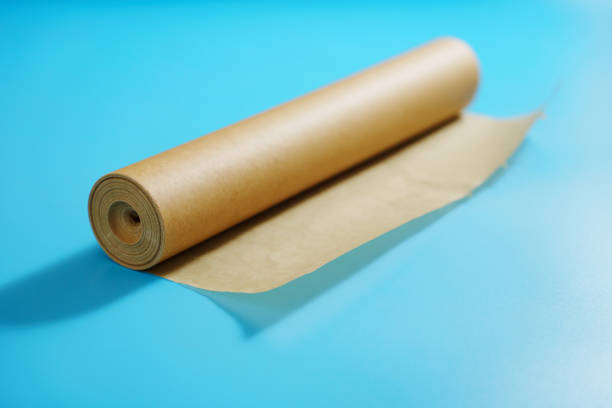 istock A roll of baking paper on a blue background. 2196503100
