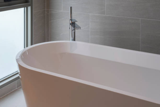 istock A modern interior of a bathroom with a bathtub, white bathtub 2196504206
