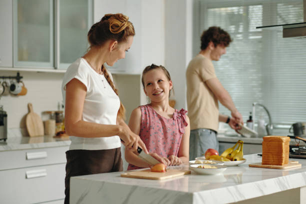 istock Family Cooking Together In The Kitchen 2196504310
