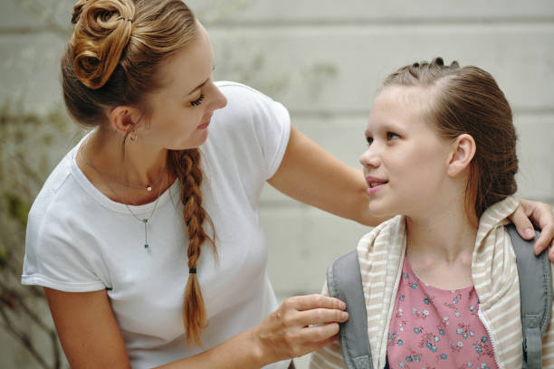 istock Mom Preparing Her Daughter For School 2196504490