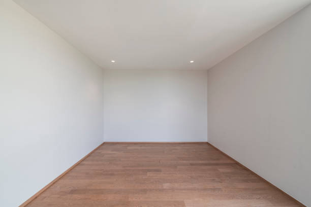 White wall and ceiling with wood floor, home interior, empty room.