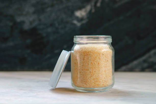 istock Psyllium husk in a glass jar on a black background, selective focus 2196505468
